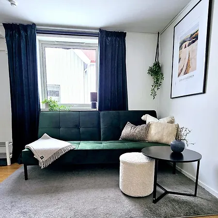 In Tromso, Located Between The Arctic Cathedral And The Cable Car Тромсё